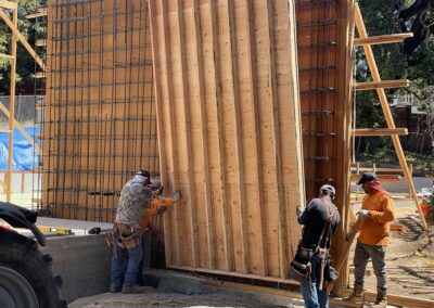 Wood framing before pouring concrete for retaining wall.