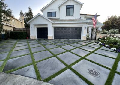 custom diamond driveway with grass intersections.